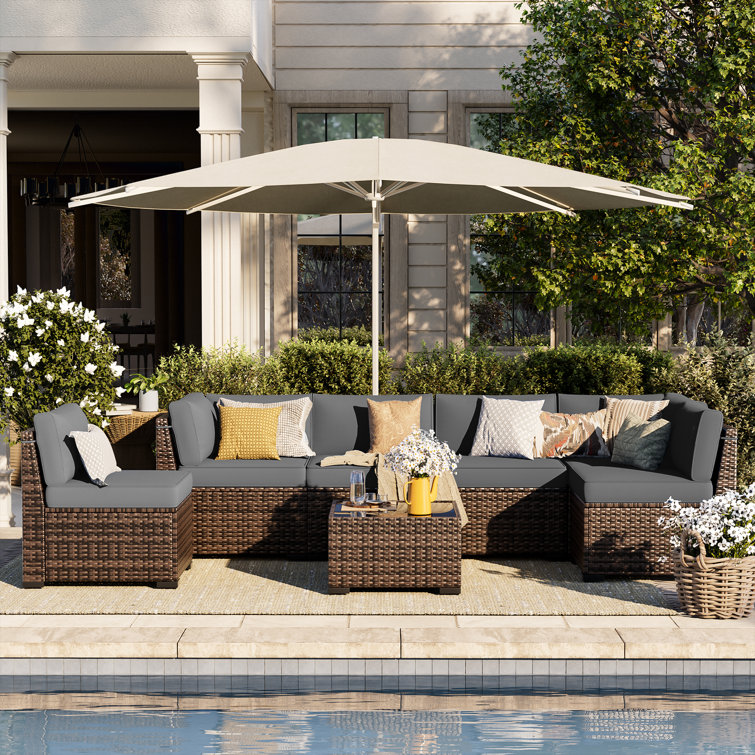 Latitude Run® 6 person Rattan Sectional Seating Group with Cushions